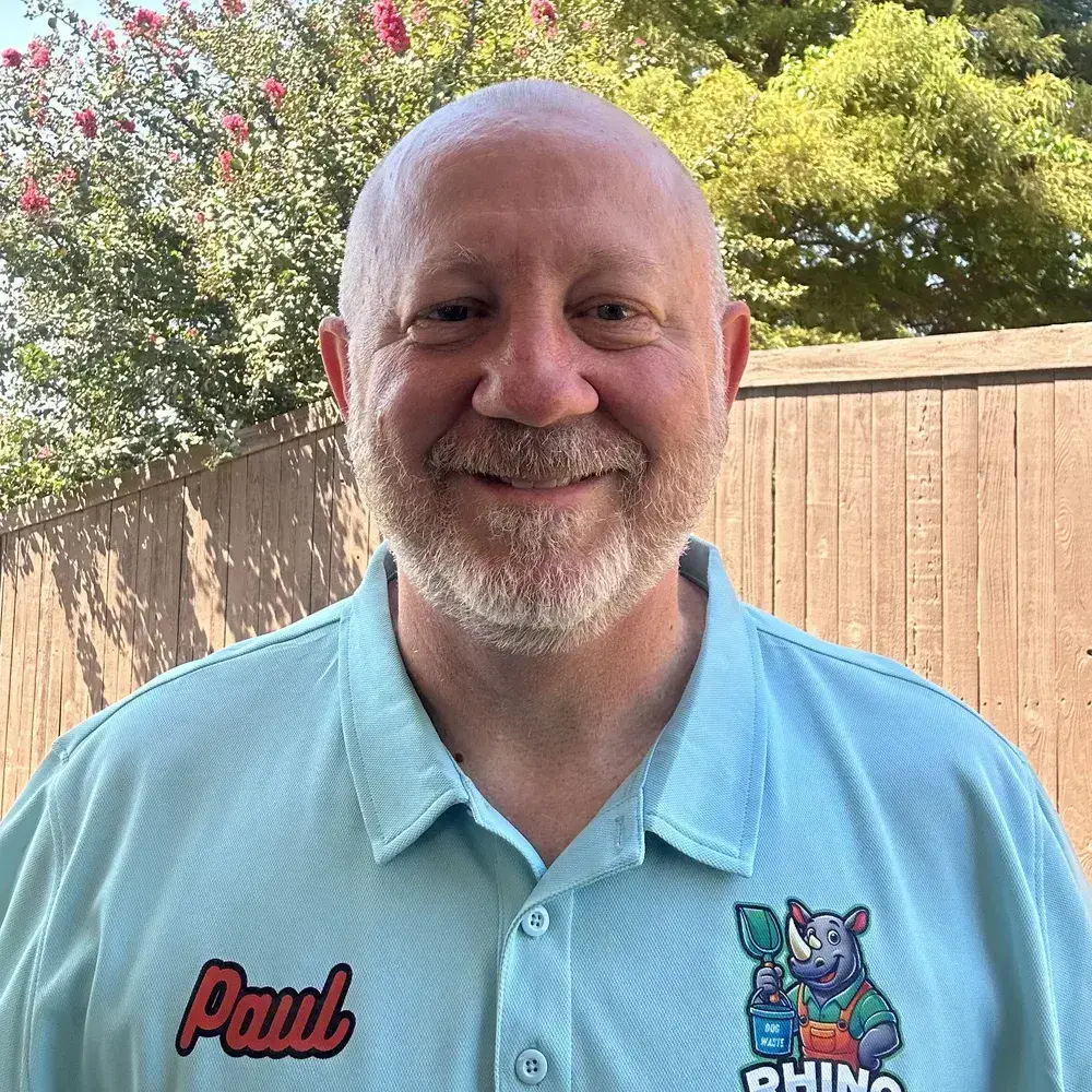 Paul, owner of Rhino Scoop, in his branded polo in a Fort Worth backyard