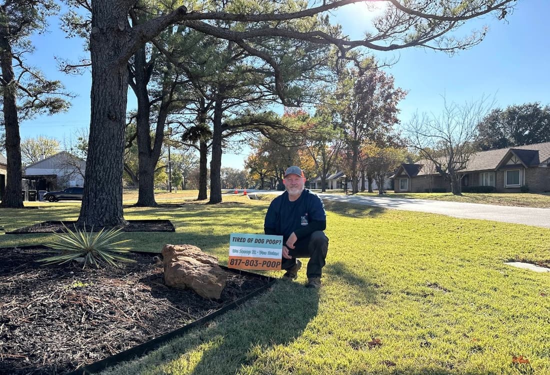 Paul with a Rhino Scoop yard sign in a Fort Worth front yard in Southlake, Texas